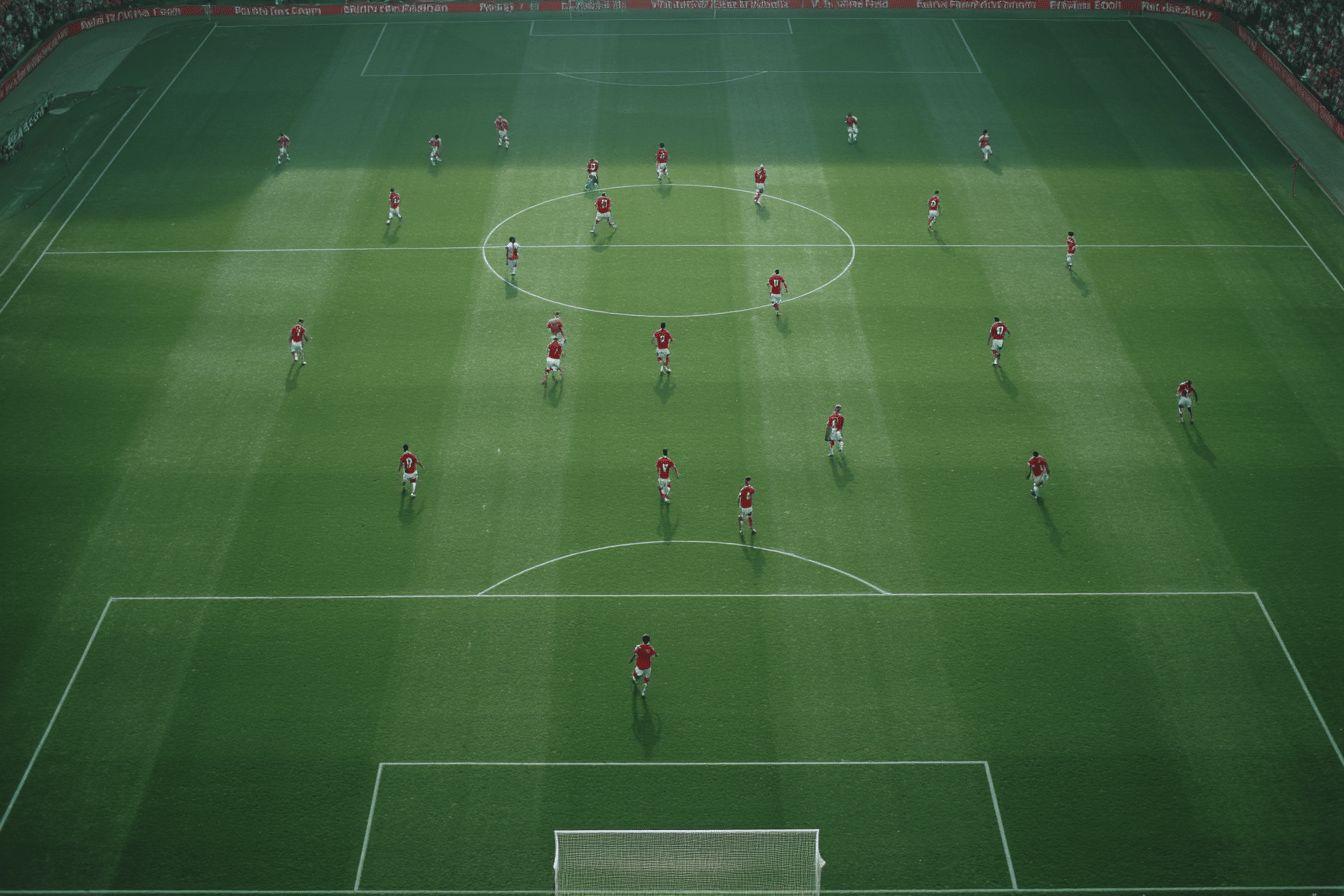 Overhead view of football players positioned on green pitch